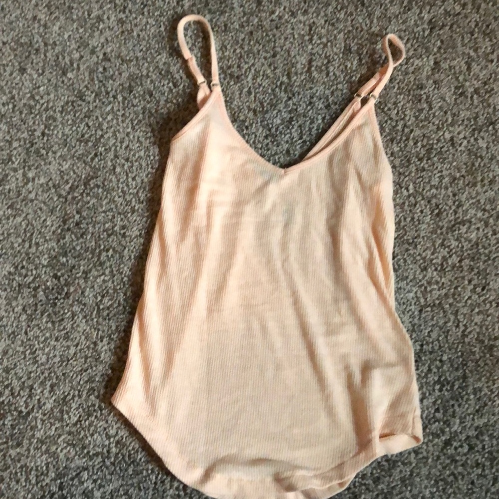 Sheer, light orange tank.